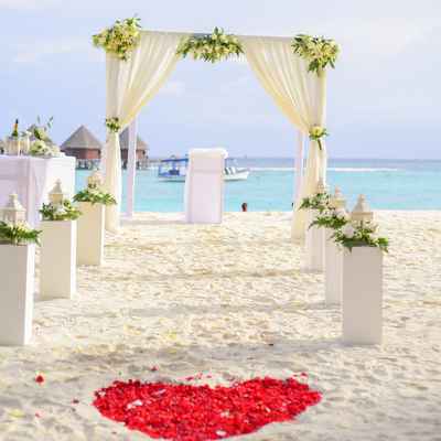 Beach ivory wedding ceremony decor